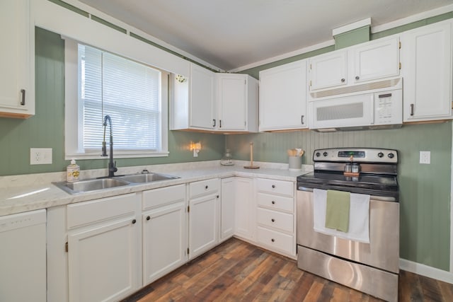 kitchen with sink, white cabinets, dark wood-type flooring, and white appliances