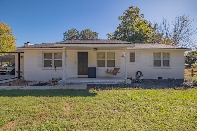 view of front of home featuring a carport and a front yard