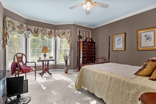 bedroom with ornamental molding, carpet, and ceiling fan