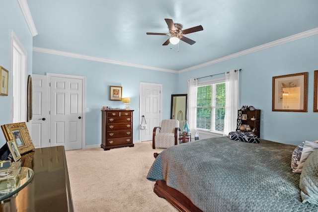 carpeted bedroom featuring crown molding and ceiling fan