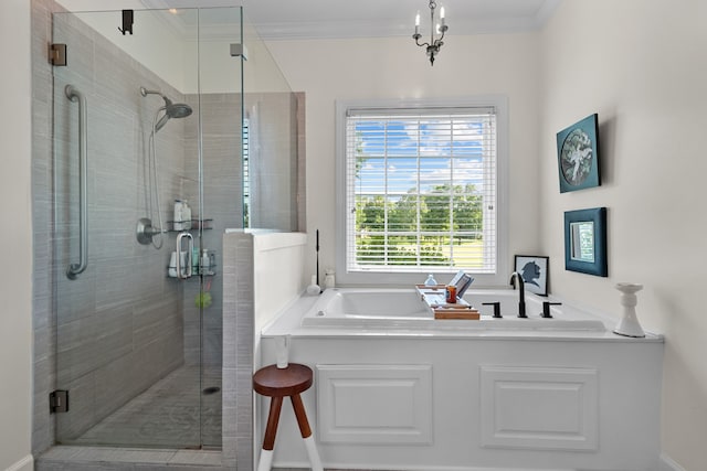 bathroom with crown molding and separate shower and tub