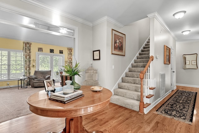 dining room with crown molding and wood-type flooring