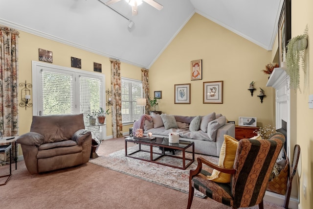 carpeted living room featuring ceiling fan, crown molding, and high vaulted ceiling