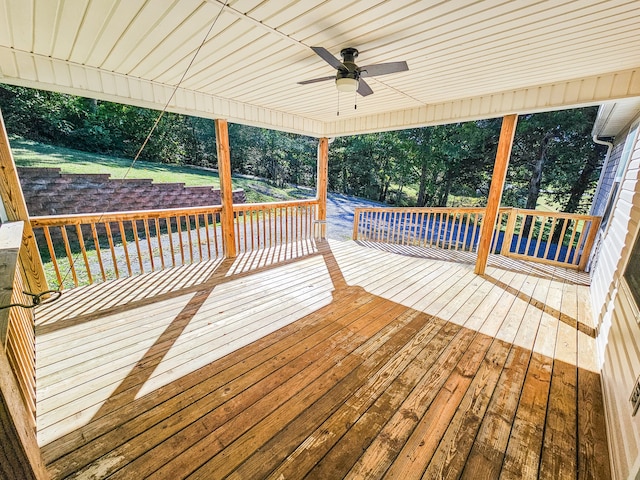 wooden terrace featuring ceiling fan