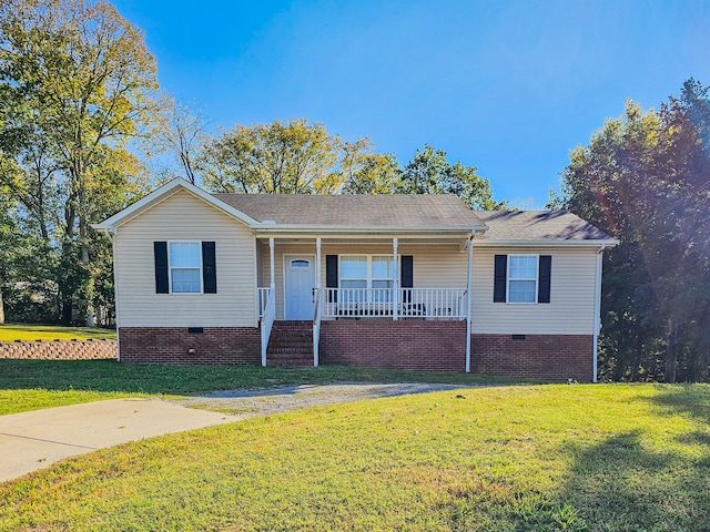 single story home with covered porch and a front lawn