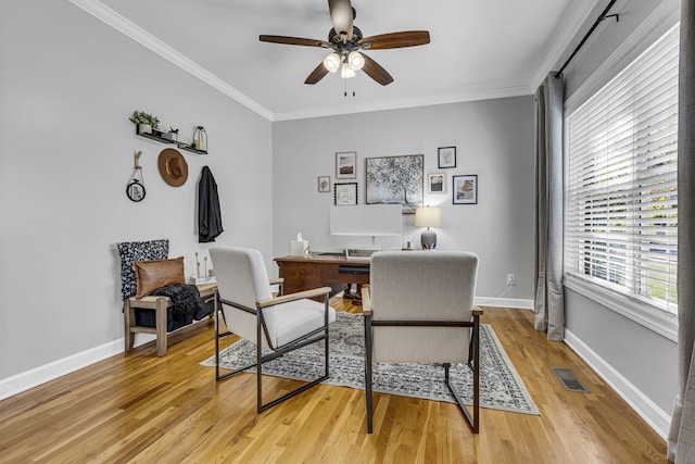 office with ceiling fan, ornamental molding, and light hardwood / wood-style flooring