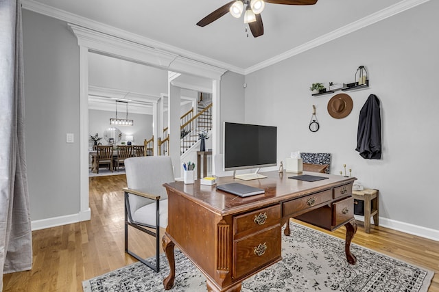 office with ceiling fan, ornamental molding, and hardwood / wood-style floors