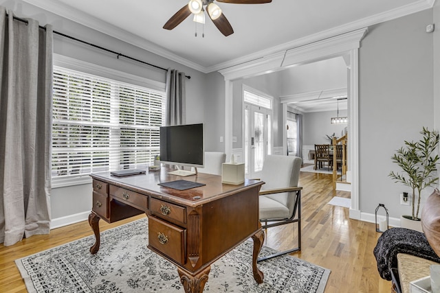 office space featuring crown molding, light hardwood / wood-style flooring, and ceiling fan