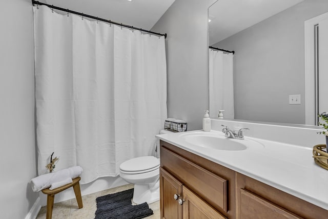 bathroom featuring vanity, curtained shower, toilet, and tile patterned floors