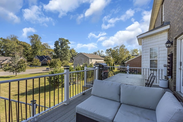 deck with outdoor lounge area and a yard