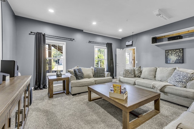 living room with a wealth of natural light and light colored carpet