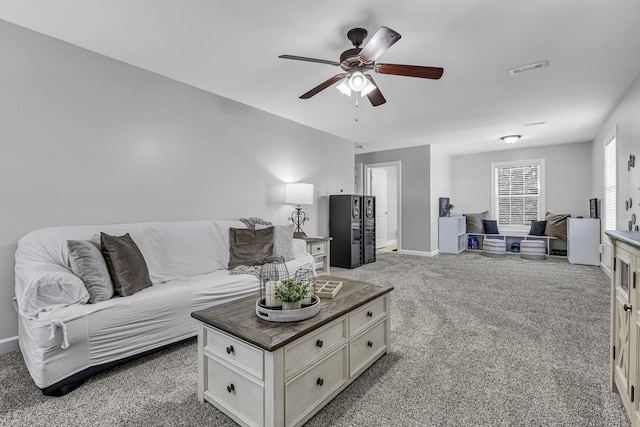 living room with carpet flooring and ceiling fan