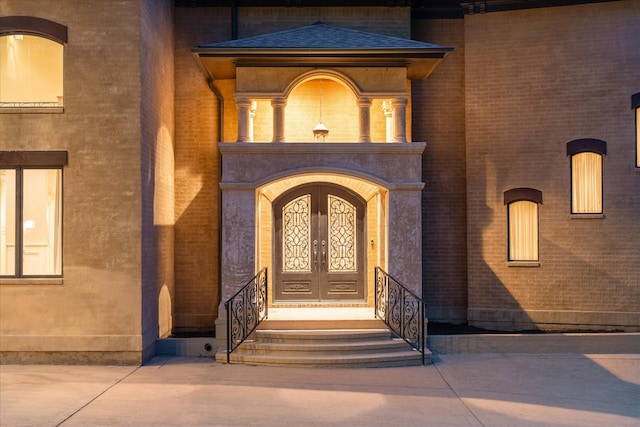 entrance to property featuring french doors