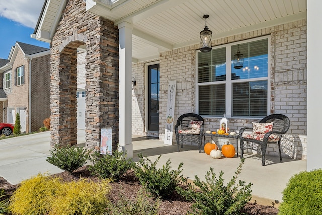 view of exterior entry with covered porch