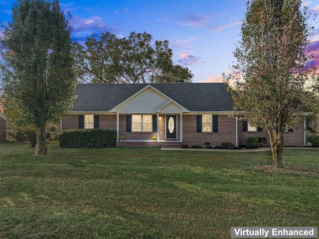 ranch-style house with a lawn