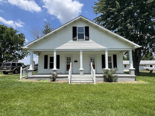 view of front facade with a porch and a front lawn