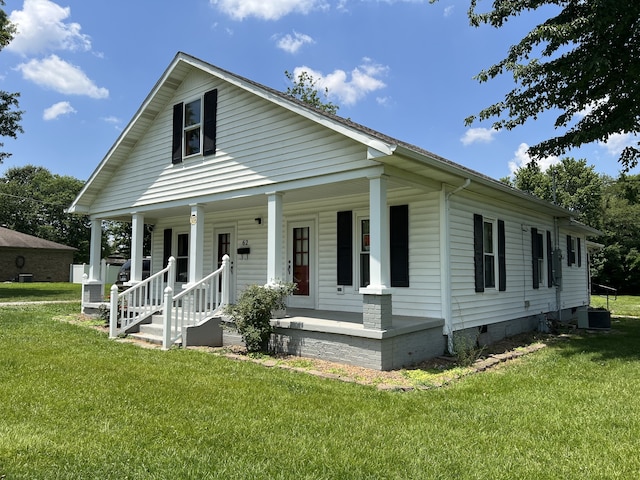 view of front of house with a front lawn and a porch