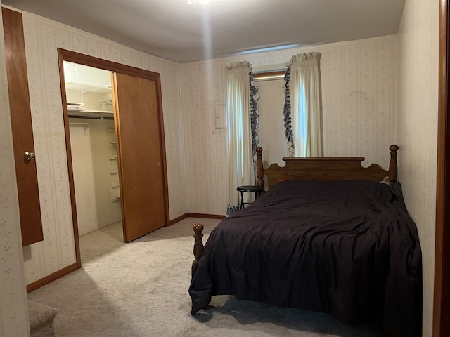 carpeted bedroom featuring a closet