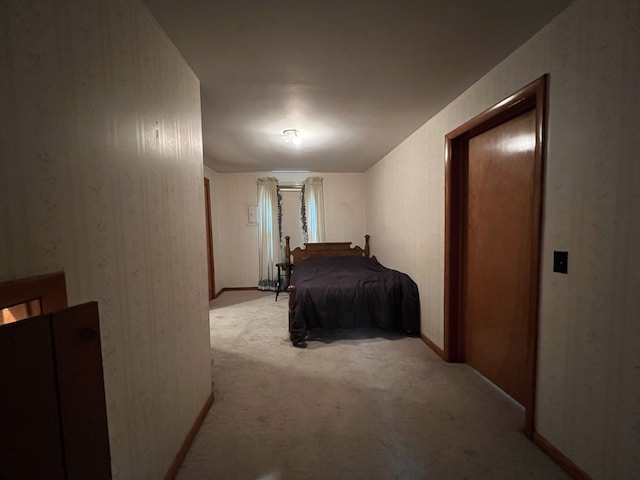 bedroom featuring light colored carpet