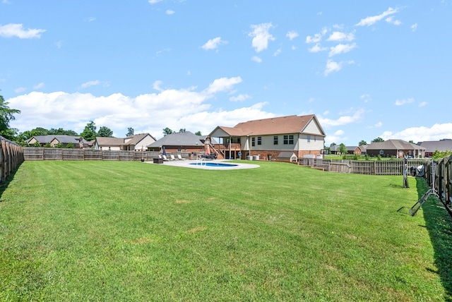 view of yard featuring a fenced in pool and a patio area