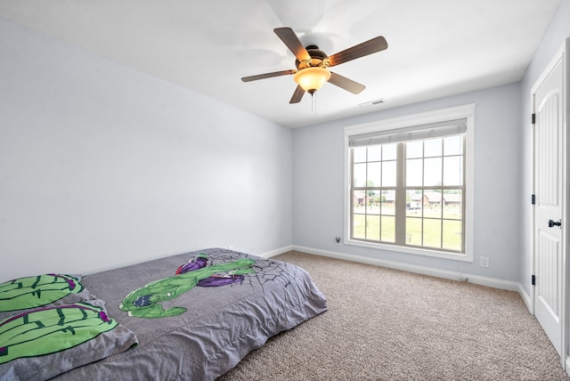 carpeted bedroom with ceiling fan