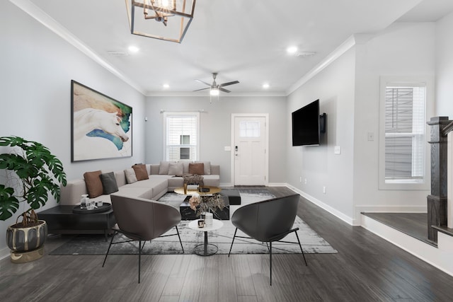 living room featuring ceiling fan, ornamental molding, and dark hardwood / wood-style flooring