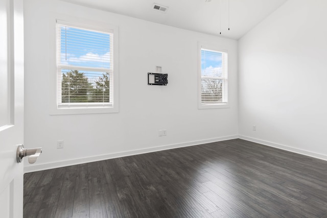 spare room with dark hardwood / wood-style floors