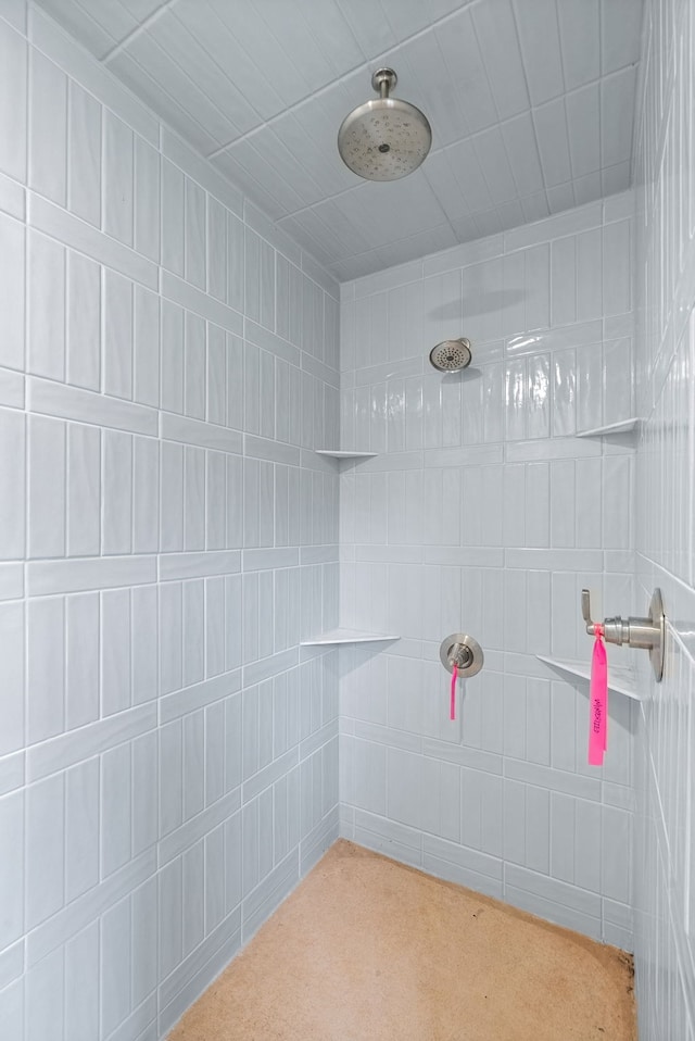 bathroom with a tile shower