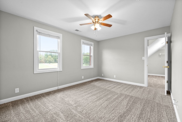 spare room featuring carpet flooring and ceiling fan