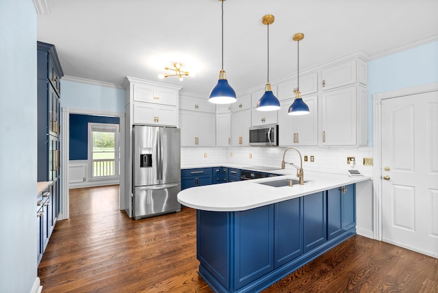 kitchen featuring stainless steel appliances, decorative light fixtures, white cabinets, dark wood-type flooring, and blue cabinetry