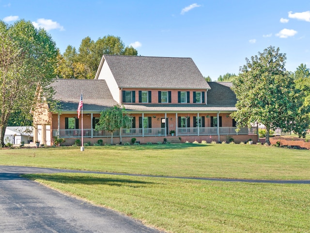 colonial-style house with covered porch and a front lawn