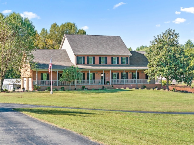 2264 Lock B Rd N, Clarksville, TN 37043 - view of front of property with covered porch, a front lawn, brick siding, and a shingled roof