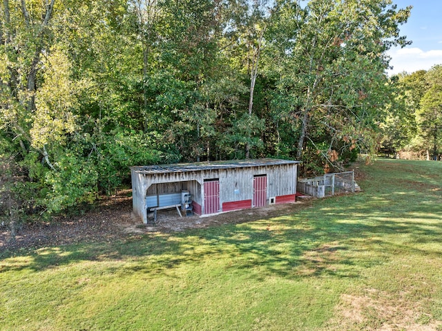 view of outdoor structure with a yard