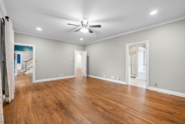 unfurnished bedroom featuring ceiling fan, wood-type flooring, and ornamental molding