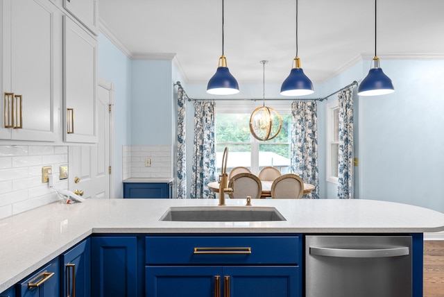 kitchen featuring dishwasher, ornamental molding, sink, pendant lighting, and blue cabinets