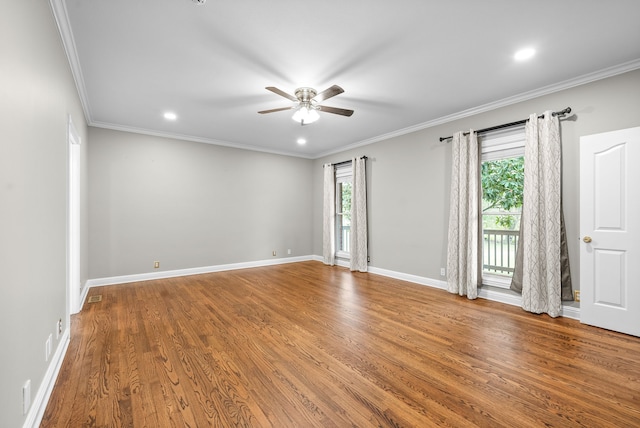 spare room featuring crown molding, hardwood / wood-style flooring, and ceiling fan