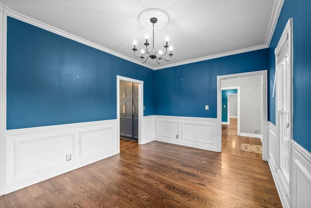 2264 Lock B Rd N, Clarksville, TN 37043 - unfurnished dining area featuring a chandelier, a wainscoted wall, crown molding, and dark wood-style flooring