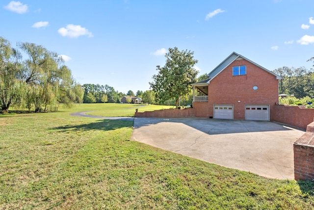 view of yard featuring a garage