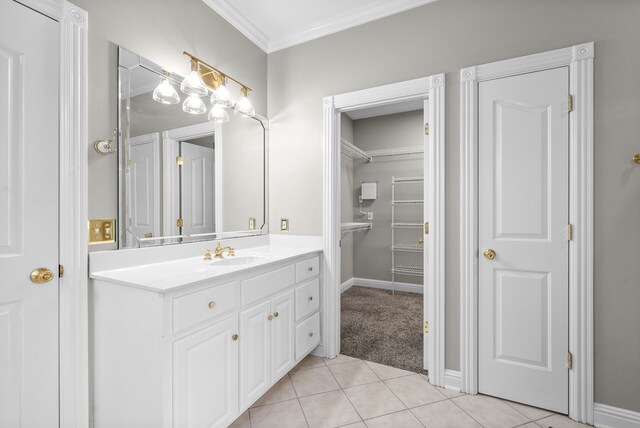 bathroom featuring vanity, crown molding, and tile patterned floors