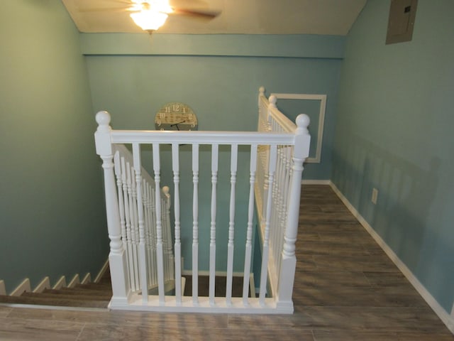 interior details with baseboards, ceiling fan, and wood finished floors