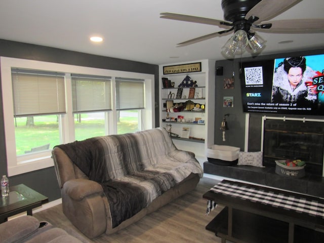 living area featuring recessed lighting, ceiling fan, and wood finished floors