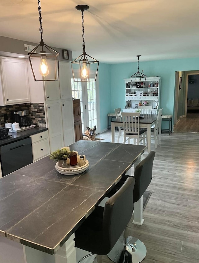 dining area featuring light wood-style flooring