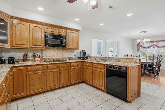 kitchen featuring light hardwood / wood-style flooring, kitchen peninsula, sink, black appliances, and ceiling fan with notable chandelier