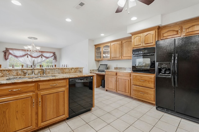 kitchen with light tile patterned floors, black appliances, and sink