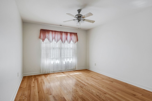 empty room featuring ceiling fan and light wood-type flooring