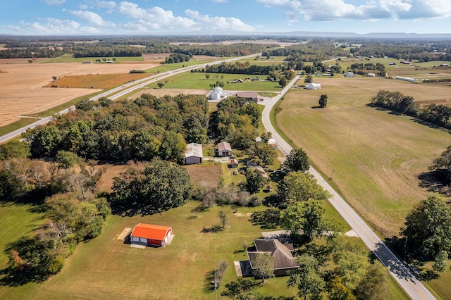 birds eye view of property featuring a rural view