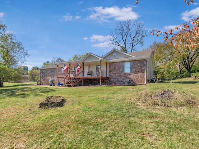 back of property featuring a yard