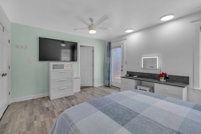 bedroom with ceiling fan and light hardwood / wood-style flooring