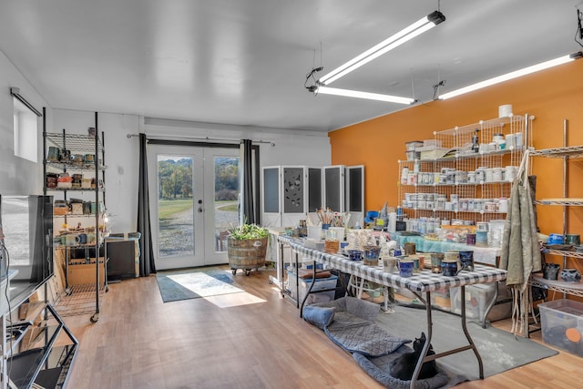 interior space with french doors and hardwood / wood-style flooring