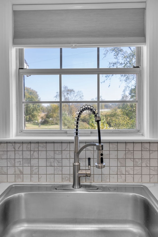 interior details with sink and tasteful backsplash